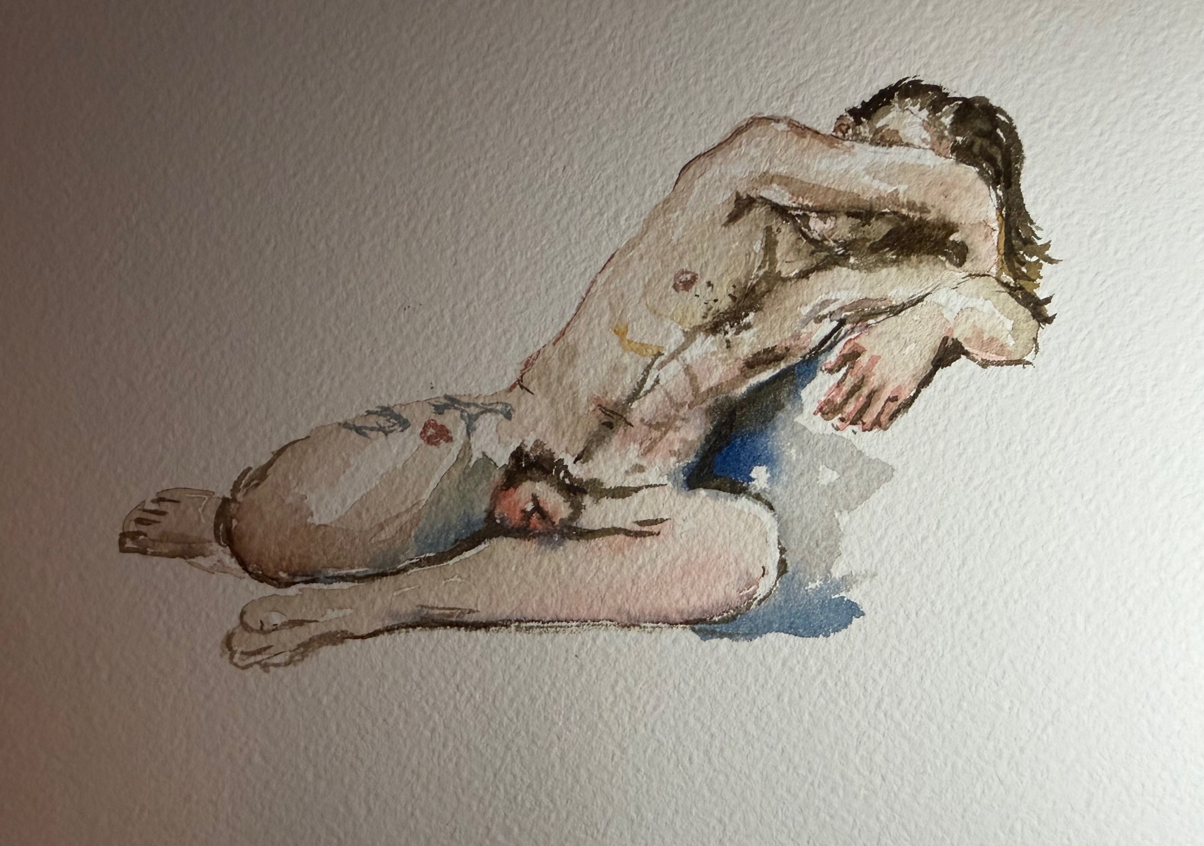 Watercolor of Kramer Evans laying naked. The palette is soft, the skin tones in red orange, rousted sienna, cerulean and cobalt blue. watercolor made during a lifedrawing sesson in aproximate 7 min. Acuarela de Kramer Evans posando desnudo en una sesion de dibujo al natural, acuarela realizada durante la sesion en 7 min. La paleta de color es delicada con tonos piel naranja y rojos, siena tostada, azul ceruleo y cobalto.